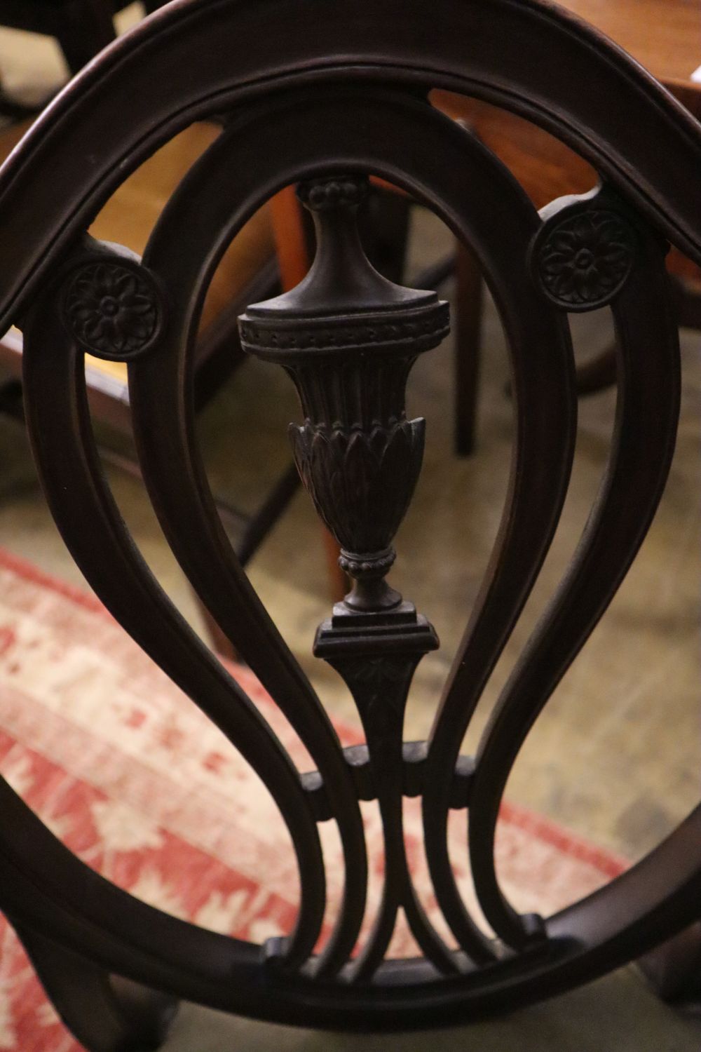 A pair of Victorian Hepplewhite style chairs with leather seats